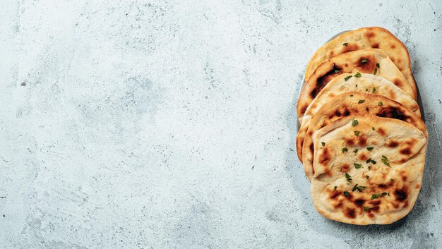 naan flatbreads on gray cement copy space