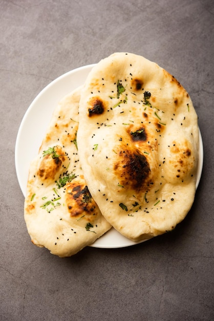 Naan nan bread served in a plate isolated