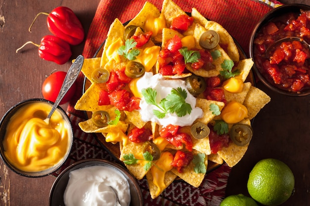 Nachos loaded with salsa, cheese and jalapeno