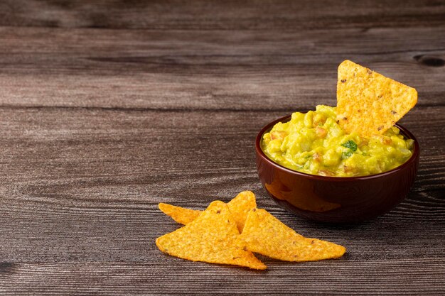 Nachos with guacamole on the table