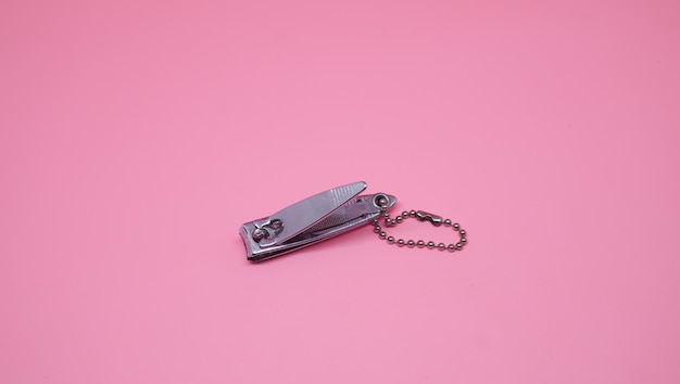 nail clipper on pink background