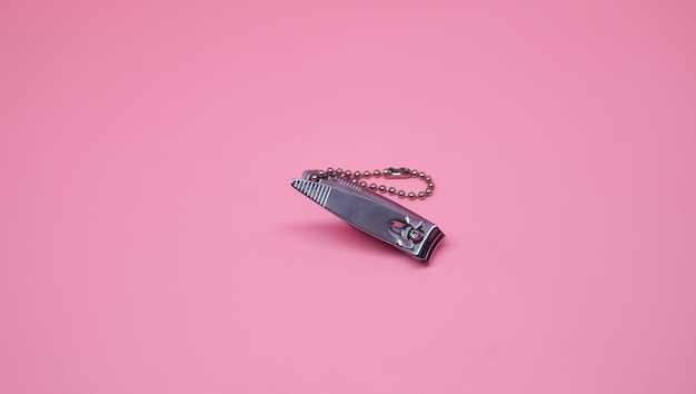 Nail clipper on pink background