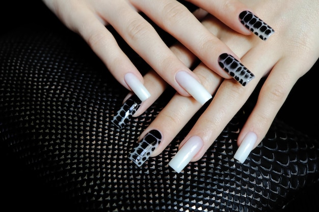 Nail design on long nails with milky white and black spreading effect on wet gel