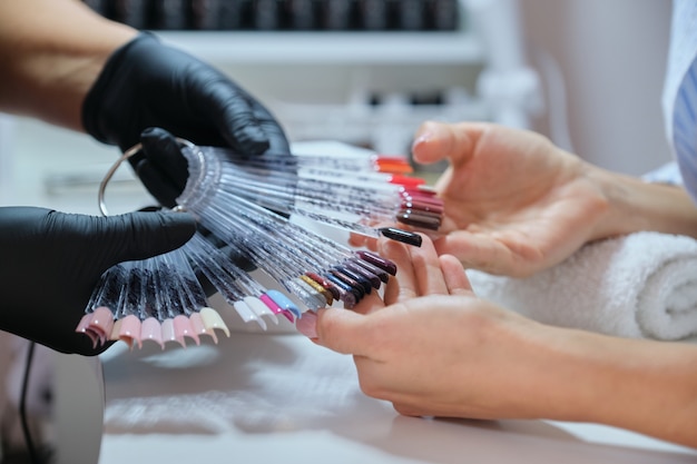 Nail and hands care, close up of female hands on manicure procedure