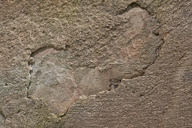 A nail on an old concrete wall