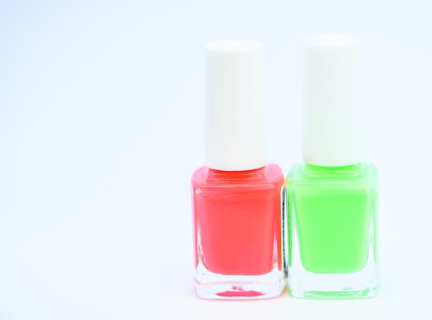 Nail polish bottles. Beauty and care concept. Nail polish white background. Durability and quality polish coating. Gel polish modern technology. How to combine colors. Manicure salon. Fashion trend.