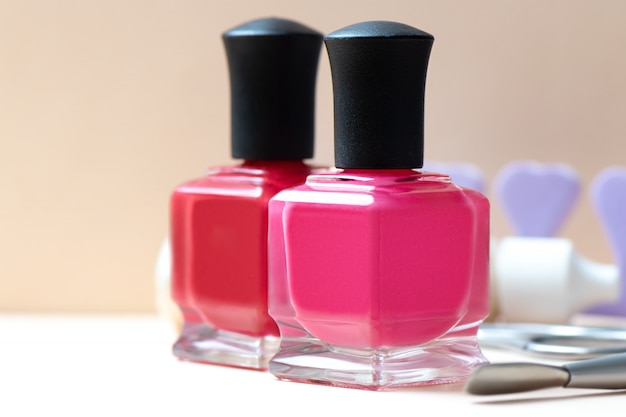 Nail polish bottles and manicure tools on a table.