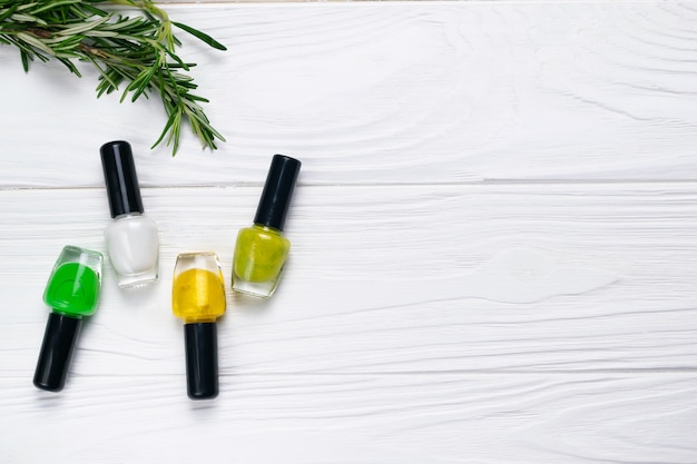 Nail polish bottles natural green and yellow colors 