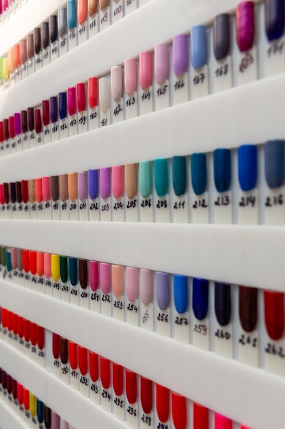 Nail polish samples of different bright colors on a white background