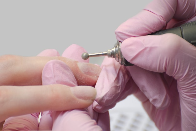 Nail treatment with a manicure cutter. 