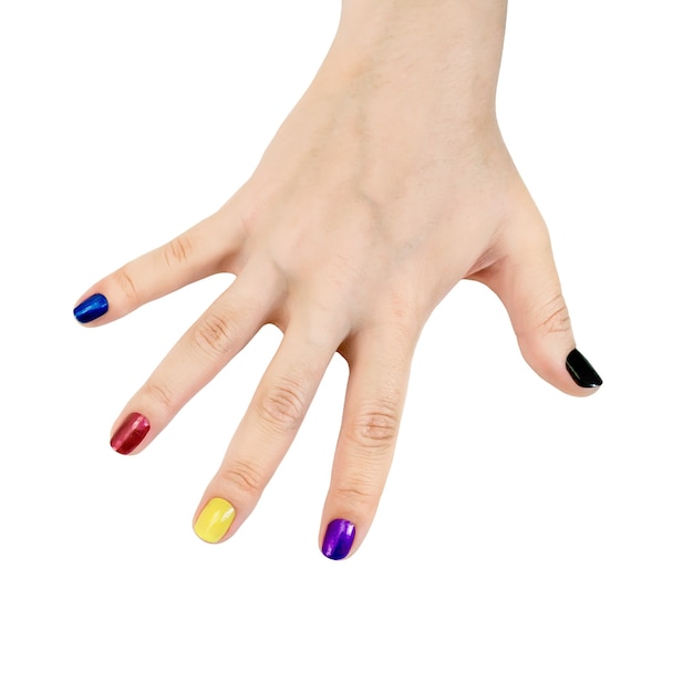 The nails on the fingers of a womans hand painted in blue, red, yellow, purple and black lacquer