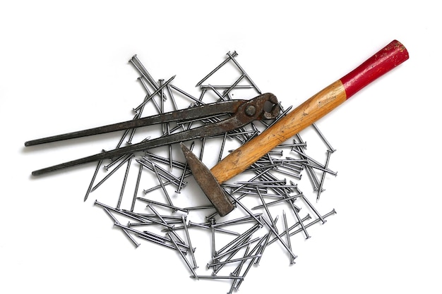 Nails hammer and pincers on a white background