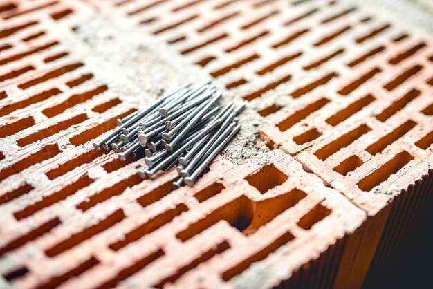 Nails and tools on construction site bricks layer and mortar New building site wallpaper carpentry and craftsmanship