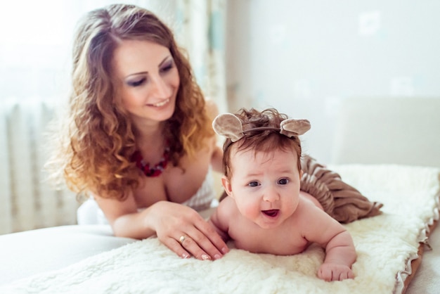 Naked baby with mother