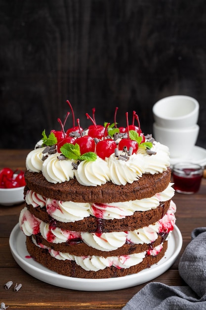 Naked Black forest cake Schwarzwald pie Cake with dark chocolate whipped cream and cherry