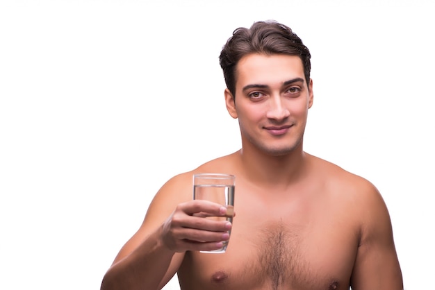 Naked man drinking water isolated on white