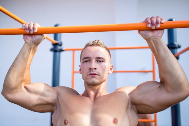 Naked torso man have a rest after rtaining outdoors in hot summer day