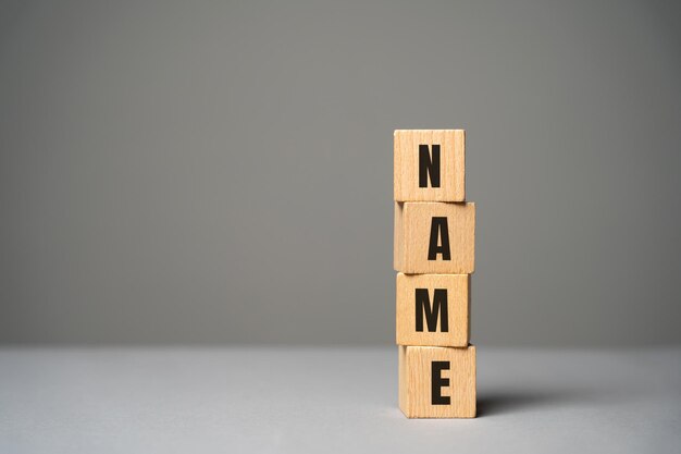 Name inscription on wooden blocks concept Creation of a new personal brand or name for a business company Logo marketing Product or idea names Copy space