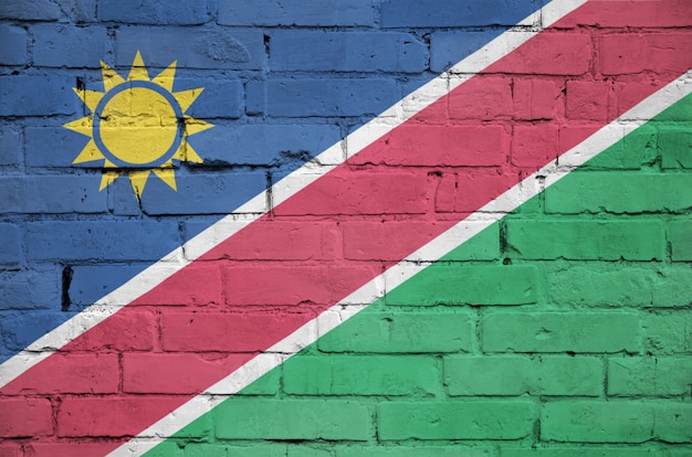 Namibia flag is painted onto an old brick wall