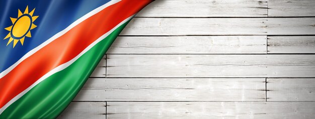 Photo namibia flag on old white wall