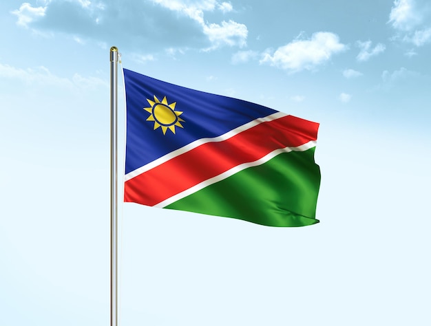 Namibia national flag waving in blue sky with clouds Namibia flag 3D illustration