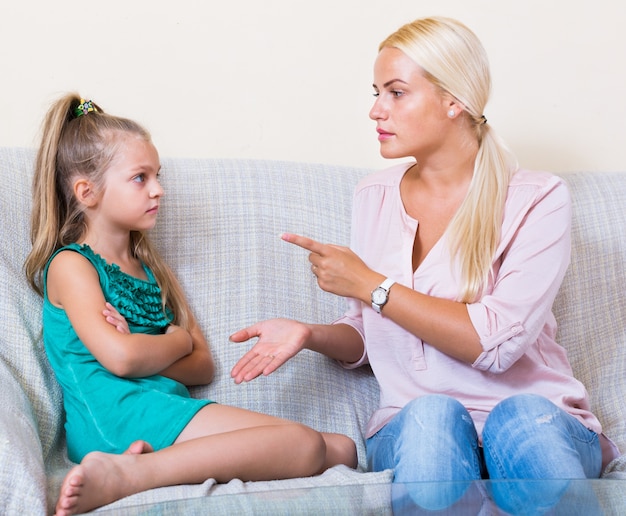 nanny scolding at little girl 