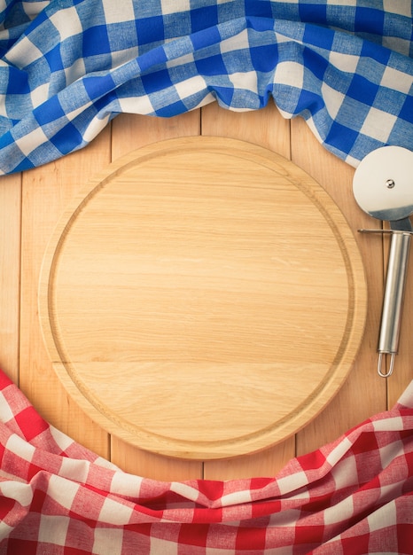 Photo napkin and cutting board on wooden background