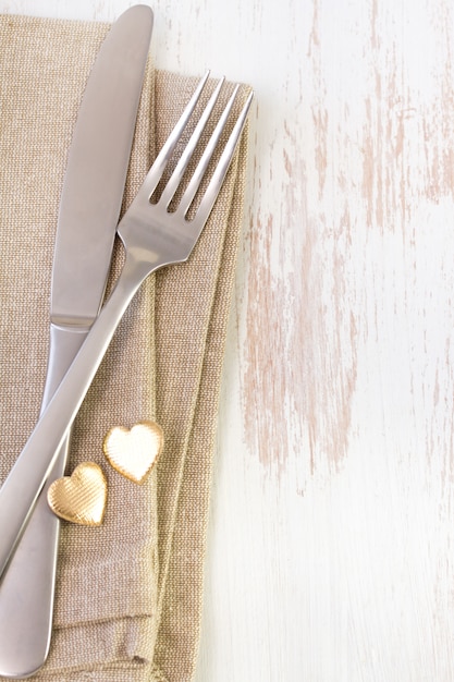 Napkin on white with fork and knife