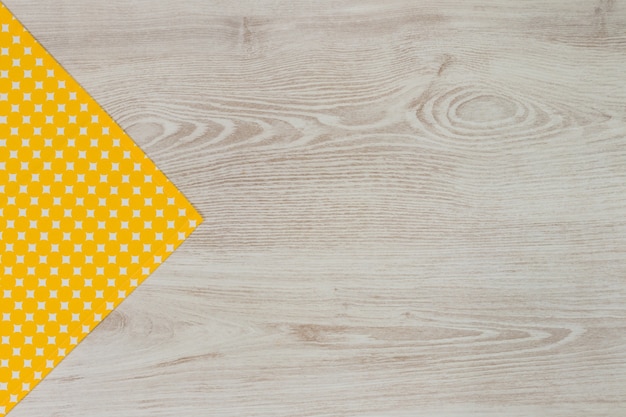 Napkin on white wooden background. top view with space for your text