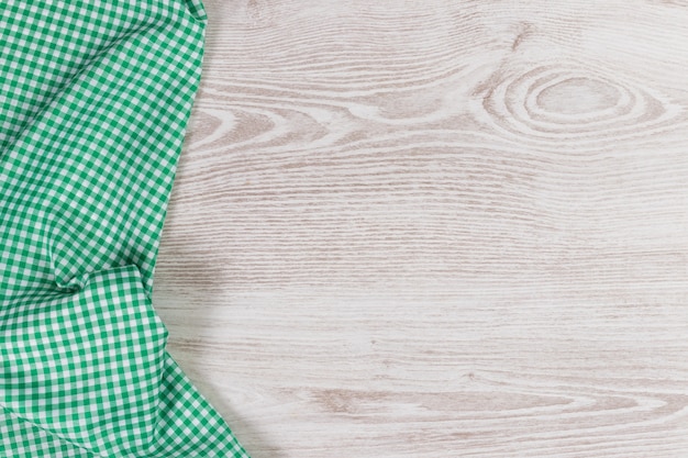 Napkin on white wooden background. Top view with space for your text.