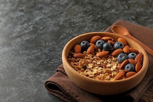 Napkin with bowl of granola on black smokey table