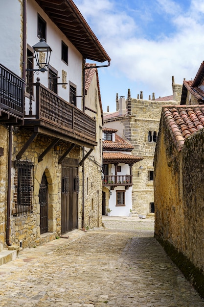 Narrow alley of old town in northern Spain with stone houses