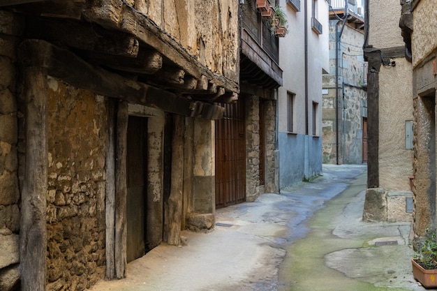 Narrow alley in the town of San Martin del Castanar. Spain