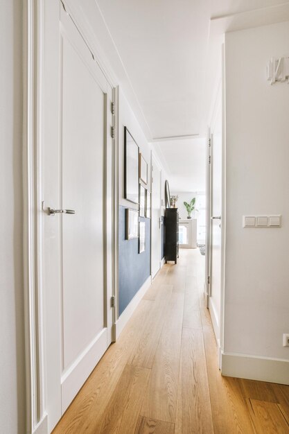 Narrow corridor with doors and lamp