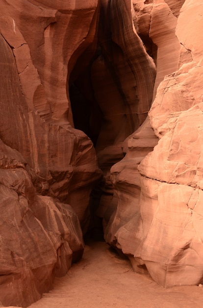 Narrow entrance into a red rock slot canyon.