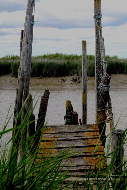 narrow jetty leading to calm lake