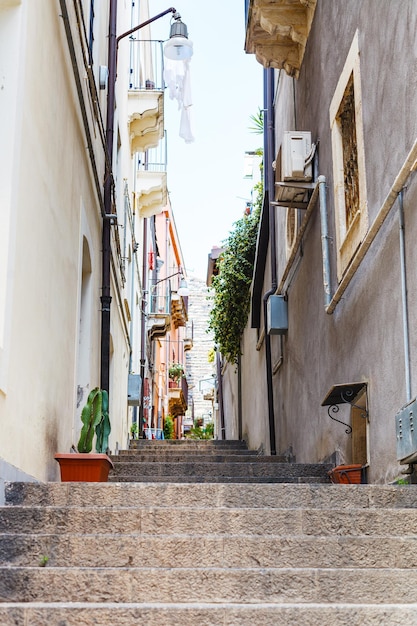 Narrow street in Catania city Sicily