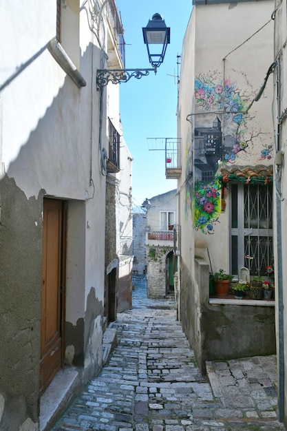 A narrow street among the old houses of Civitacampomarano a town in the state of Molise in Italy