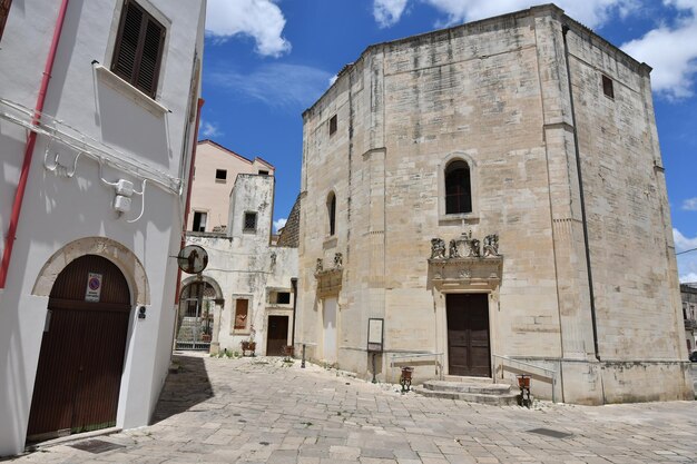 A narrow street between the old houses of Galatina a village in the province of Lecce in Italy