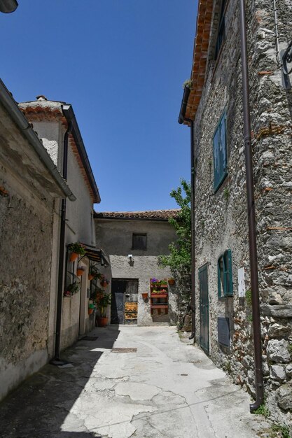 A narrow street between the old houses of Marsicovetere a village in Basilicata Italy