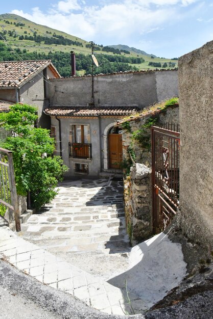 Photo a narrow street between the old houses of marsicovetere a village in basilicata italy