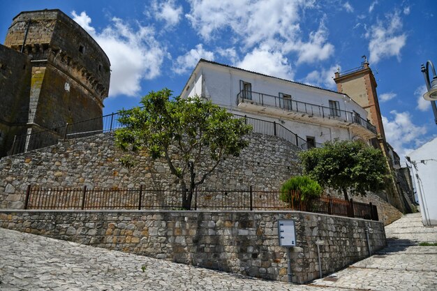 A narrow street between the old houses of Rocchetta SantAntonio a medieval village in Puglia Italy