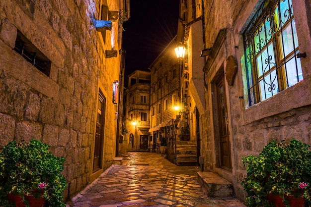 Narrow street of Old Town in Kotor at night