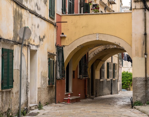 Narrow street with arch between homes in Kerkyra