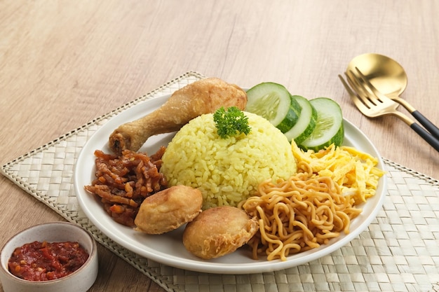 Nasi kuning, Indonesian traditional food, made from rice cooked with turmeric, coconut milk, spice