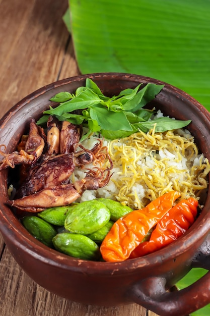 Nasi Liwet Sunda A traditional Sundanese rice dish of white rice cooked with spices and anchovies