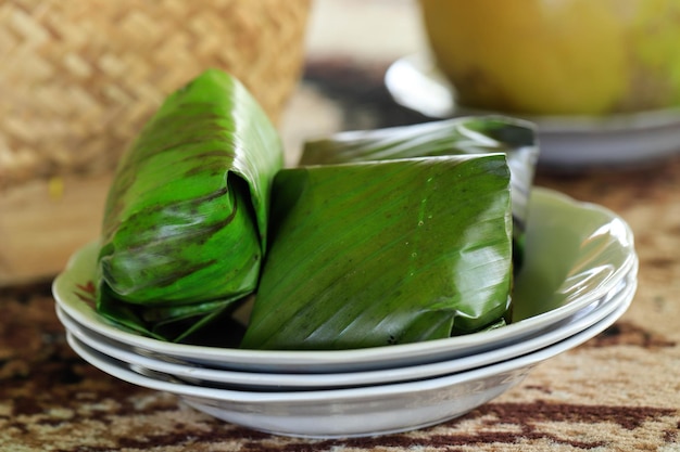 Nasi Timbel is Indonesian Traditional - Sundanese Wrapped Steamed Rice in Banana Leaf. Usually Served with Side Dishes, Raw Vegetables, and Sambal