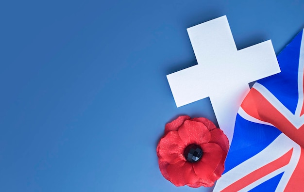 National british holiday memorial day concept with cross uk\
flag and poppy flower