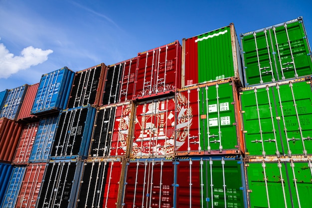 national flag of Afghanistan on a large number of metal containers for storing goods stacked in rows