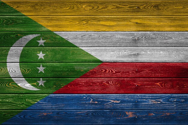 The national flag of Comoros
 is painted on a camp of even boards nailed with a nail. The symbol of the country.